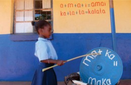 First grade student Choolwe Chiwala shows off her newly-acquired phonetic reading skills.