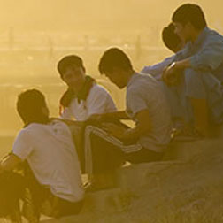 Afghan boys talking on a hill.