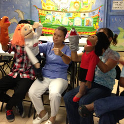 Panamanian Adults giving puppet show.