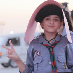 Libyan Girl giving peace sign.