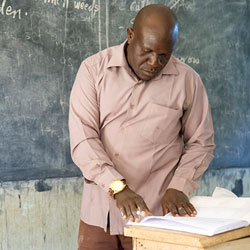Nigerian Teacher Writing