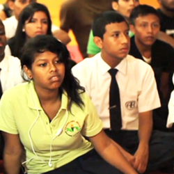 Panamanian teens listening to instructor.