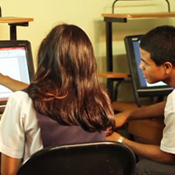 Panamanian teens using computer.