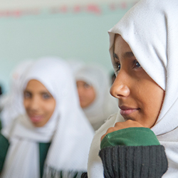 Yemen girl smiling in classroom.