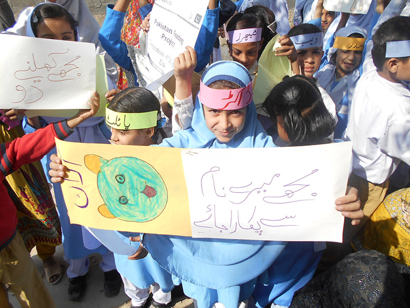 Children colored signs about children’s rights to celebrate Universal Children’s Day.