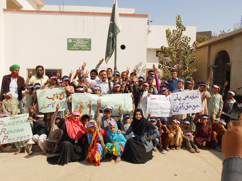 On community walks, parents and children displayed signs raising awareness about children’s rights.