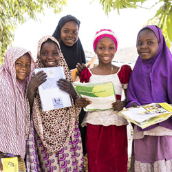 Nigerian girls holding books.