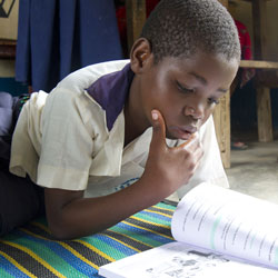 Tanzanian child reading.