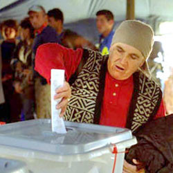 Man casting vote in Kosove Election in the year 2000.