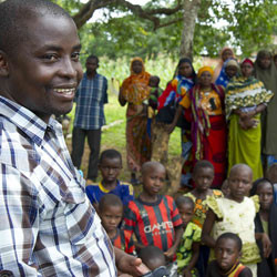 Head Teacher Yusuf Tahuka addresses a gathering of community members in Tanzania.