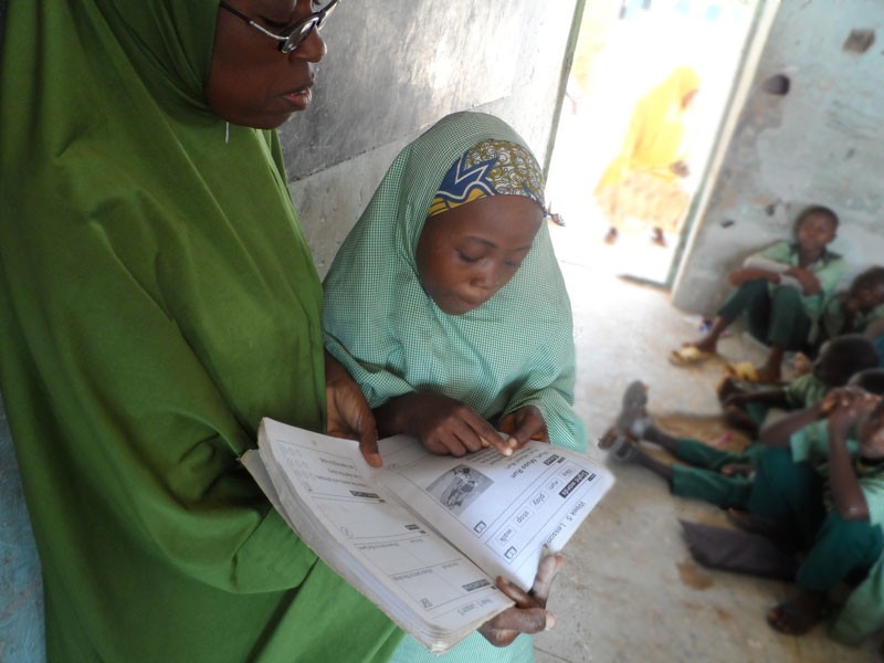 Zainab_One-of-her-hobbies-is-reading-her-Lets-Read-textbooks_IN-STORY 