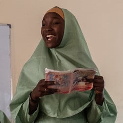 A Nigerian girl speaks in front of her class.