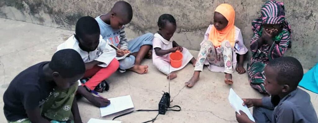 banner_Bauchi-Children-Listenining-to-UNICEF_USAID-Radio-lesson-2-1024x398