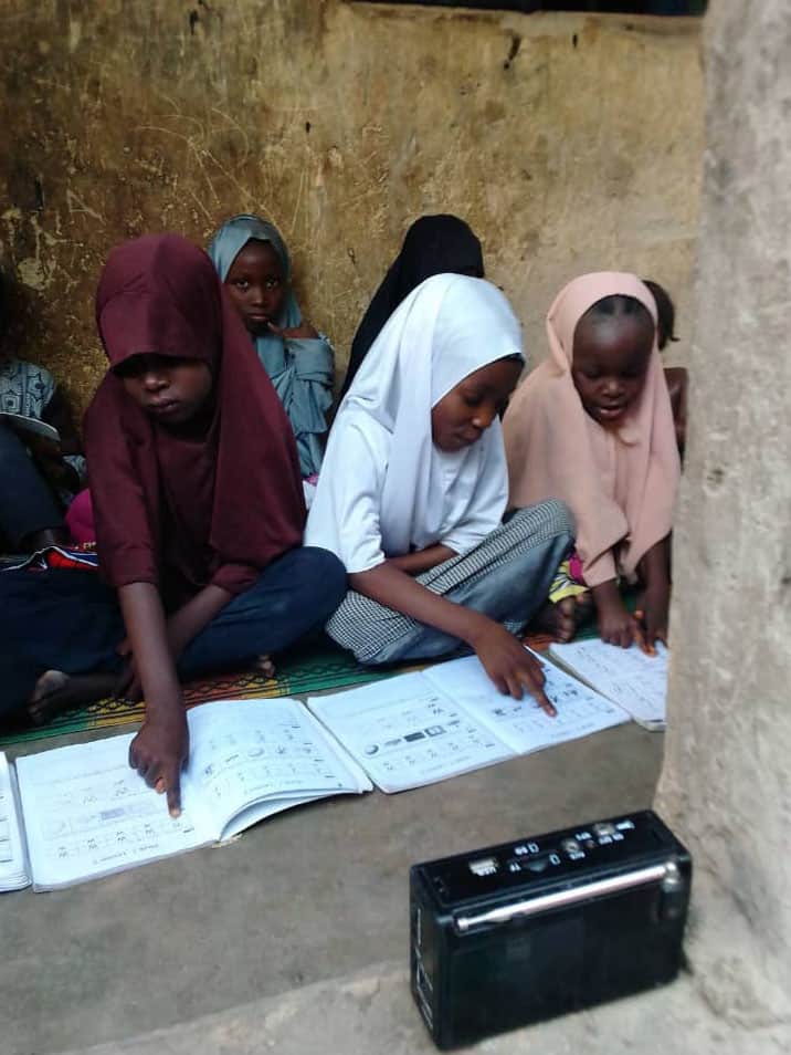vert_Bauchi-Children-Listenining-to-UNICEF_USAID-Radio-lesson-7-1 