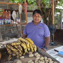 A Honduran man at his small roadside shop.