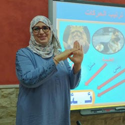 A Moroccan teacher interprets a lesson into Moroccan Sign Language