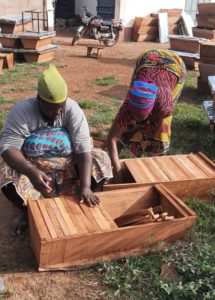 Burts-Bees-inspection-photo-caption-2.-Burt’s-Bees-SheKeepers-in-northern-Ghana-inspecting-their-new-beehives.-Photo-credit-Marc-Amessi.jpg-e1638807319855-215x300 